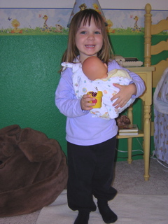 "Brooke's in the sling and I am feeding her, Mommy!"